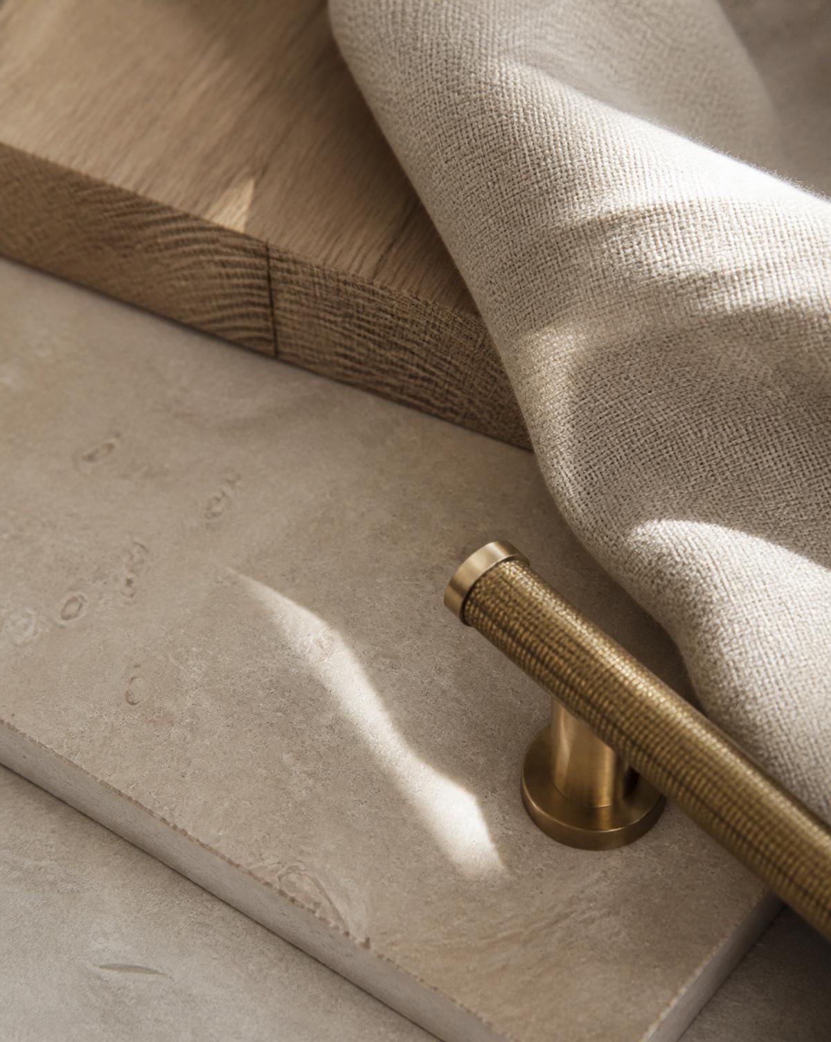 Limestone, oak timber, linen and brass material detail